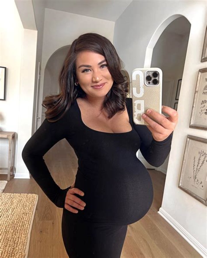 13 Clever AF Photos Of Celebs Who Hid Baby Bumps With Bags, Blankets & Even An Actual Baby