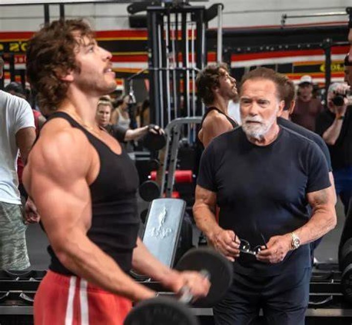 Arnold Schwarzenegger’s Son Joseph Baena, 23, Lifts His Shirt To Show Off His Progress At The Gym