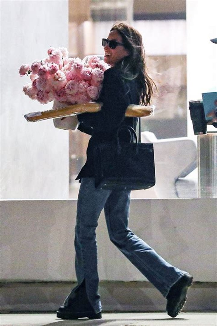 Brad Pitt’s GF Ines de Ramon Is All Smiles As She Leaves Work With Flower Bouquet On Valentine’s Day