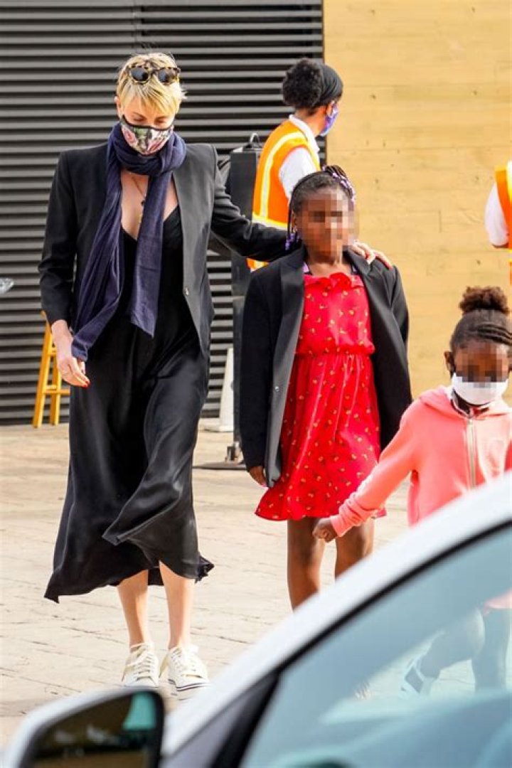 Charlize Theron Posts Rare Photo Of Daughters Jackson, 8 & August, 3, During Her 45th Birthday Party