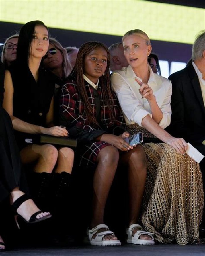Charlize Theron Snuggles 1 Of her Daughters In Rare Photo As She Gears Up For 2022