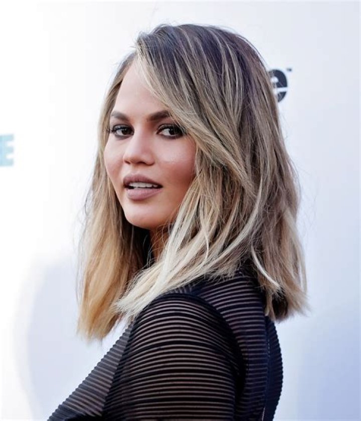 Chrissy Teigen Shows Off ‘Midlife’ Hair Makeover With Long, Silver Locks: See Videos