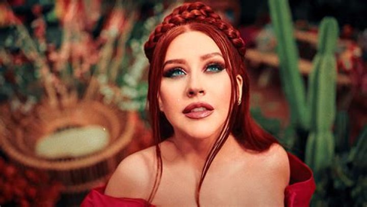 Christina Aguilera Wears Fiery Red Dress in “La Reina” Music Video – Hollywood Life