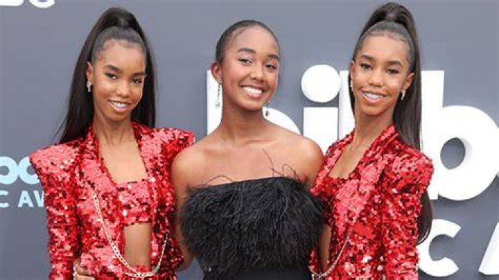 Diddy’s Twin Daughters Rock Sparkly Red Pantsuits Alongside Their Sister In A Mini Dress