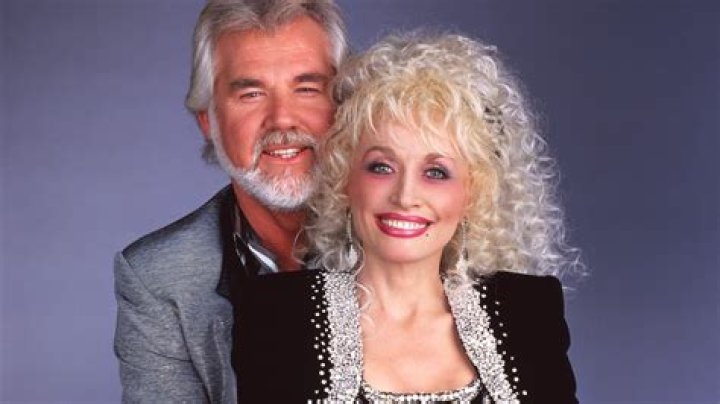 Dolly Parton Mourns Friend Kenny Rogers: ‘He’ll Be Asking God To Spread Some Light On This Darkness’