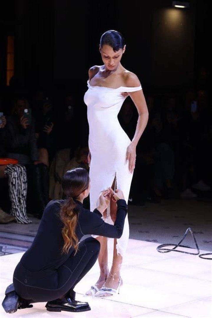 Gigi & Bella Hadid Hold Hands & Slay In Long Dresses At Paris Fashion Week Event – Pics