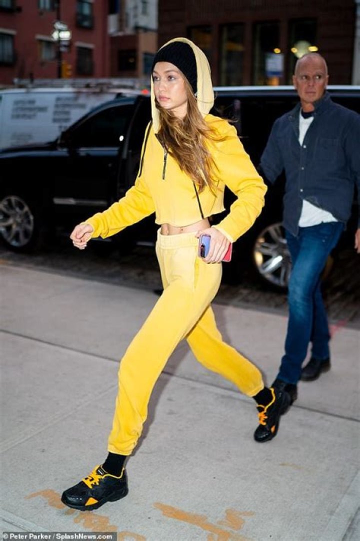 Gigi Hadid Slays In Bright Yellow Tracksuit & You Can Shop This Similar Outfit For Less