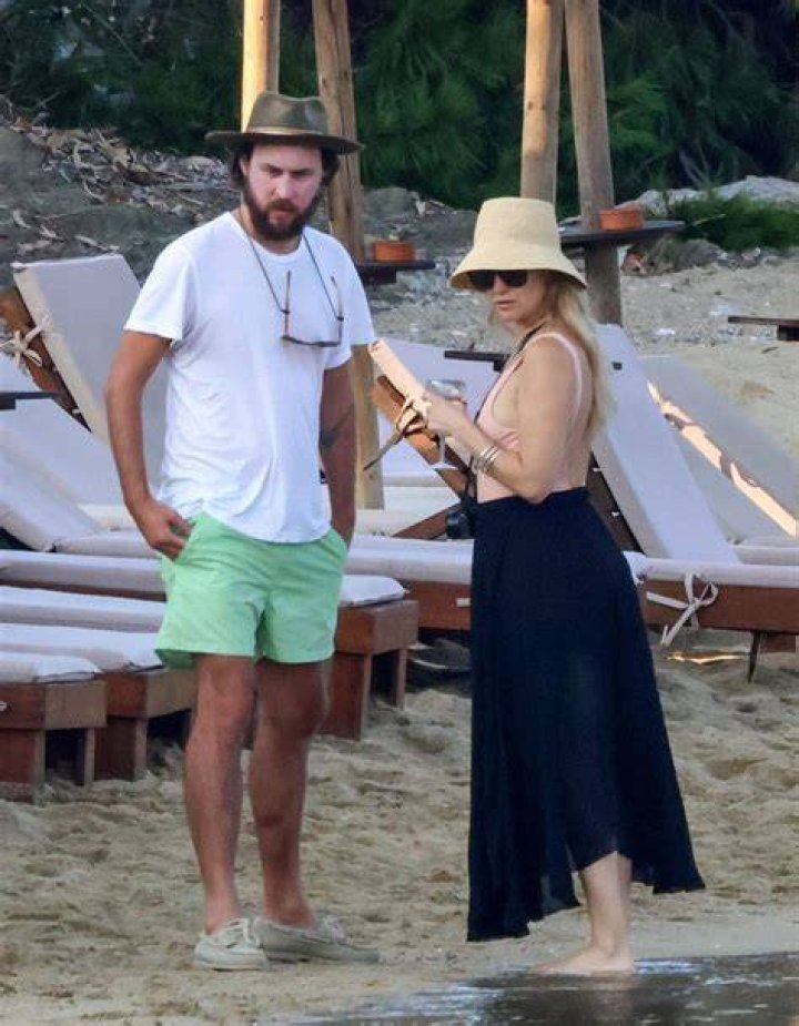 Kate Hudson, 42, Sizzles In Plunging Black Swimsuit As She Hits The Beach In Greece With Danny Fujikawa