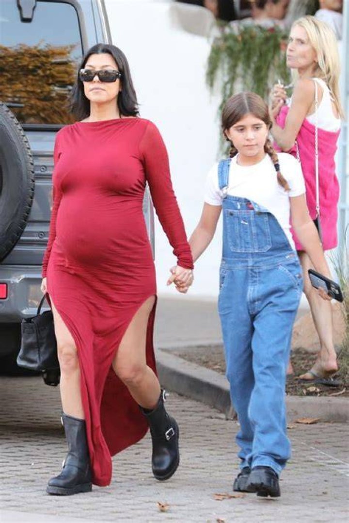 Kourtney Kardashian Debuts Baby Bump In A Sexy String Bikini