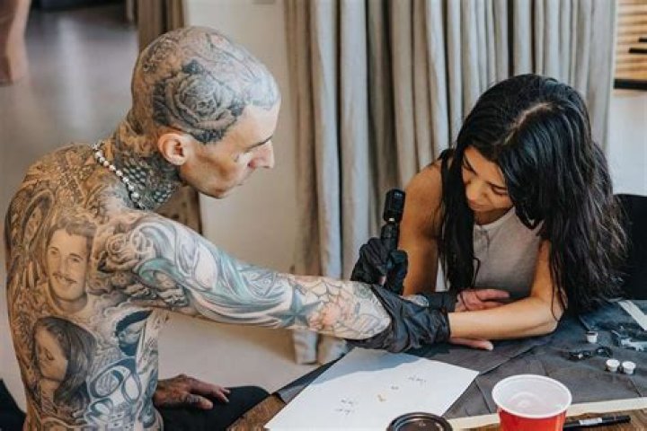 Kourtney Kardashian Tattoos ‘I Love You’ Into Travis Barker’s Arm — Watch