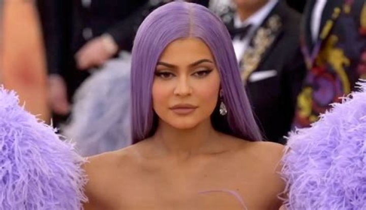 Kylie Jenner Stuns In Pink Strapless Bra Top While Rubbing Lip Oil On Her Plump Pout — Pic