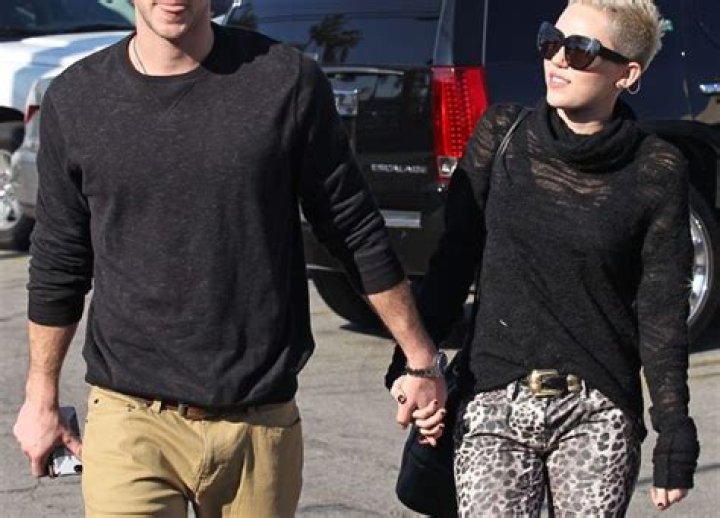 Liam Hemsworth Caught Flirting With Emma Watson — Report
