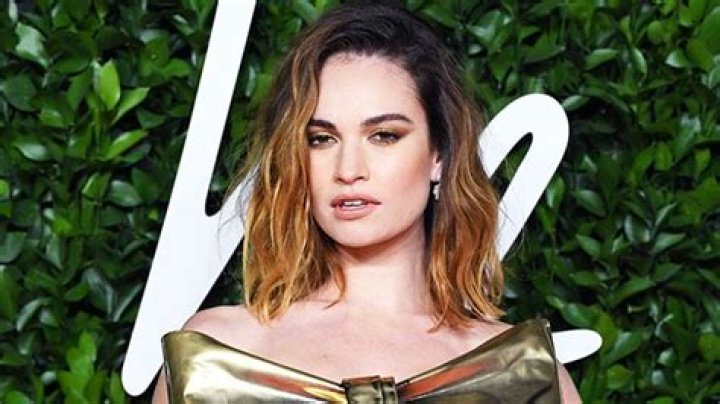 Lily James Channels Pamela Anderson With Iconic Messy Up-Do & Metallic Lamé Mini Dress