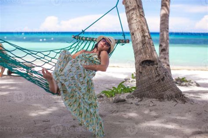 Lindsay Lohan Rocks A Pink Cover-Up While Lounging On A Hammock In The Maldives