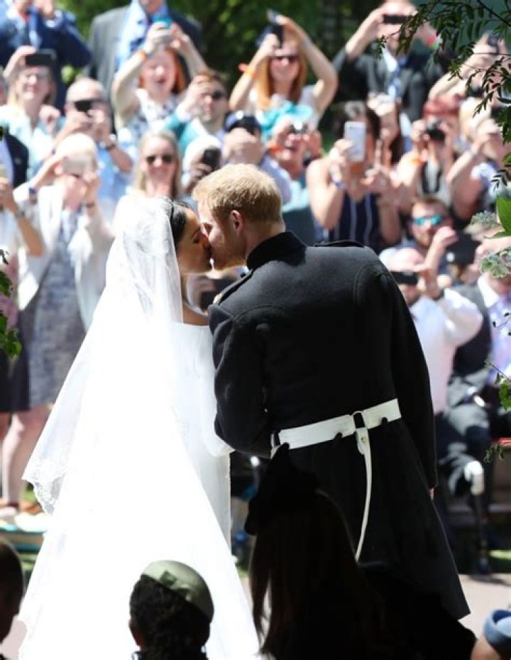 Prince Harry & Meghan Markle’s Wedding Day PDA — Photos