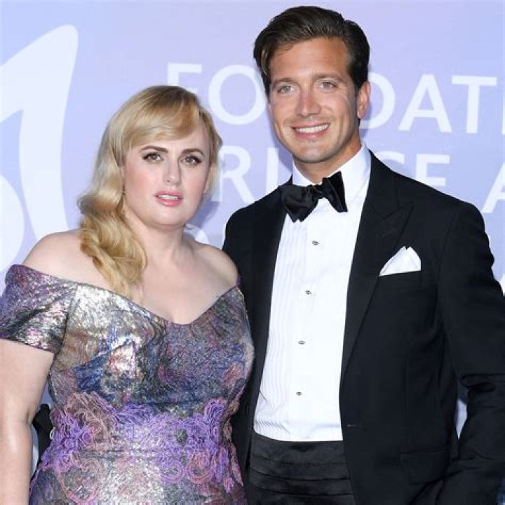 Rebel Wilson Cozies Up To Shirtless Boyfriend Jacob Busch After They Make Their Red Carpet Debut