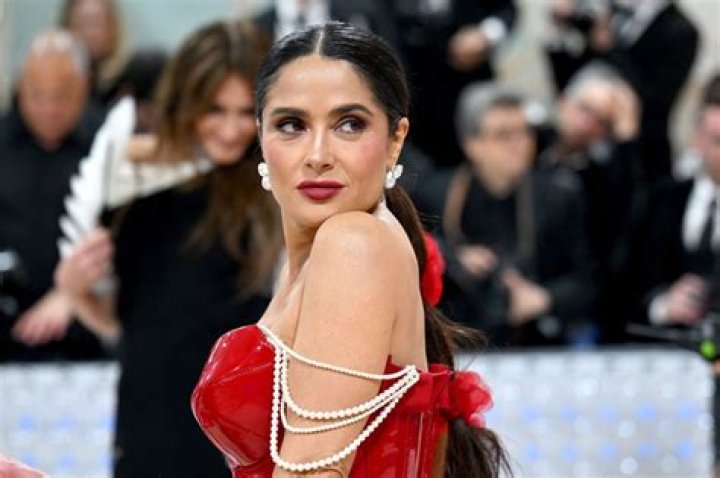 Salma Hayek, 52, Stuns In Cutout Swimsuit While Soaking Up The Sun In New Vacay Clip