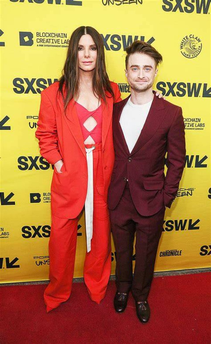 Sandra Bullock, 57, Rocks Sexy Orange Top With Cutouts In Rare Photo At SXSW With Daniel Radcliffe