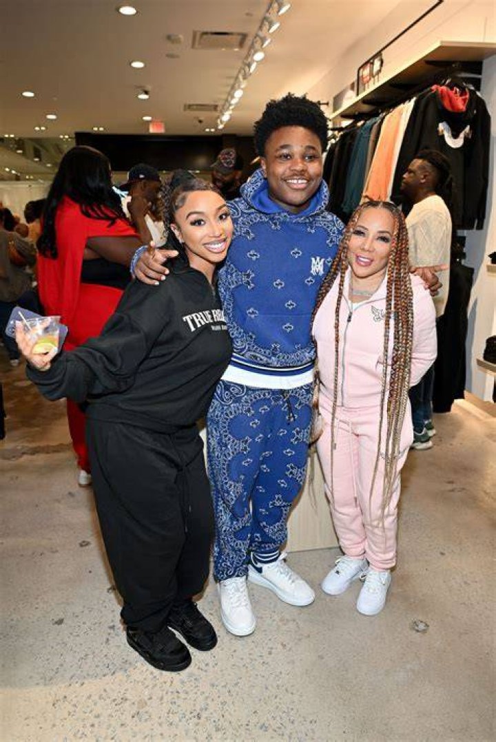 Tiny Cradles Daughter Zonnique’s Baby Bump In Sexy Black Jumpsuit At T.I.’s 40th Birthday Bash — Pic