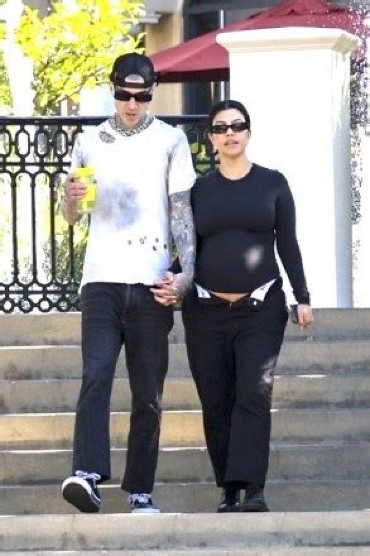 Travis Barker & Kourtney Kardashian Kiss, Lay In Bed & More In PDA Photos For Her 44th Birthday