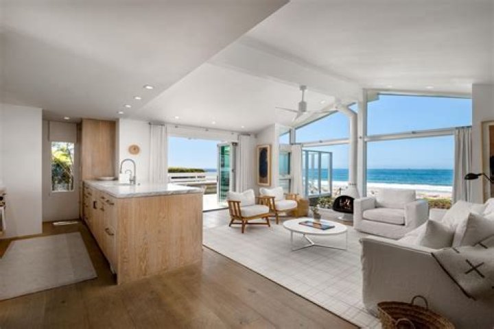 Why Kourtney Kardashian & Travis Barker Bought A ‘Total Dream’ Beach House For 1st Home Together (Exclusive)